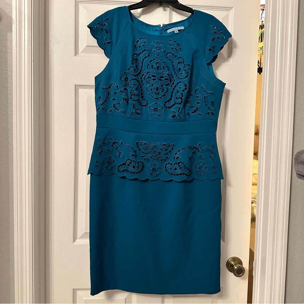 Peplum dress with lace cutouts